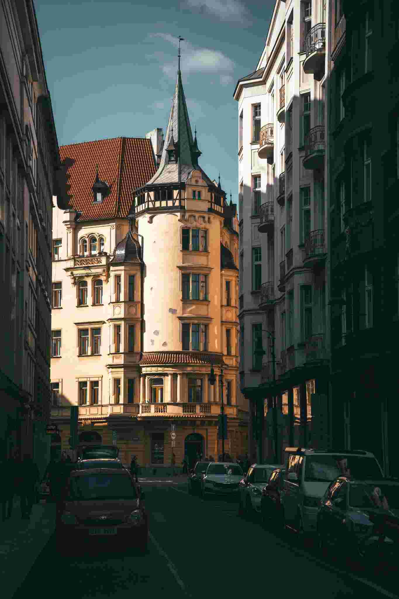 Art Nouveau-style building on a narrow Prague street, evoking the atmospheric setting of the spy thriller Surviving Prague