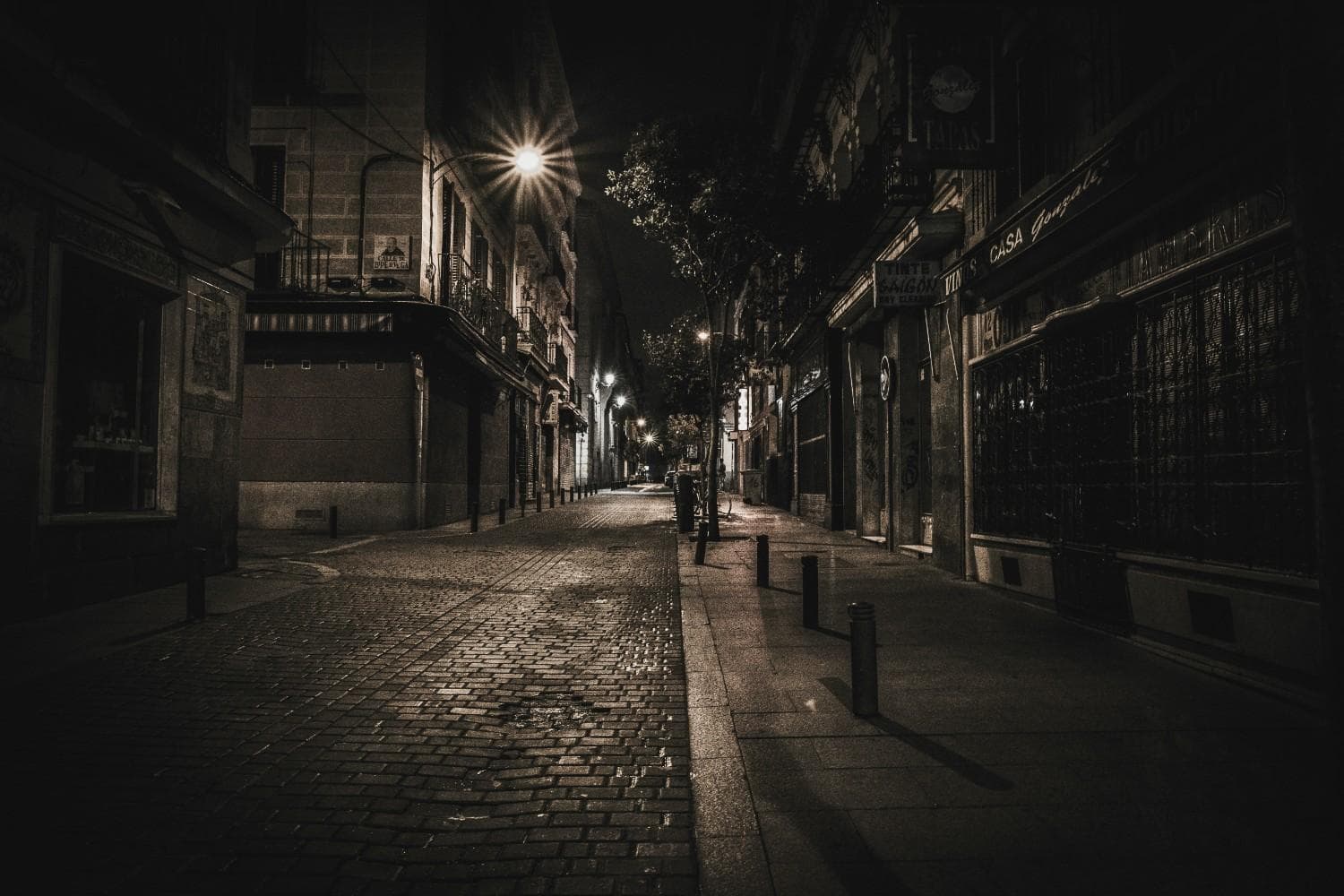 Dark, moody European street at night, setting the tone for the 1970s espionage thriller The Hollow Man