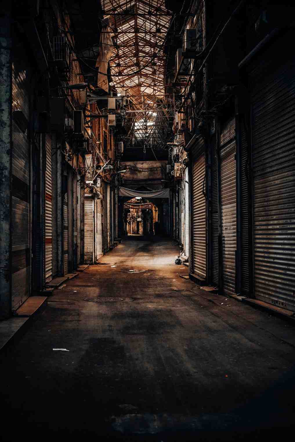 A dimly lit alley in Monte Carlo symbolizing the danger and intrigue of Cold War espionage settings.
